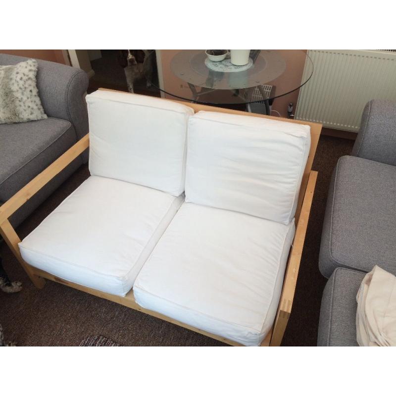 2x two seater wooden frame sofas