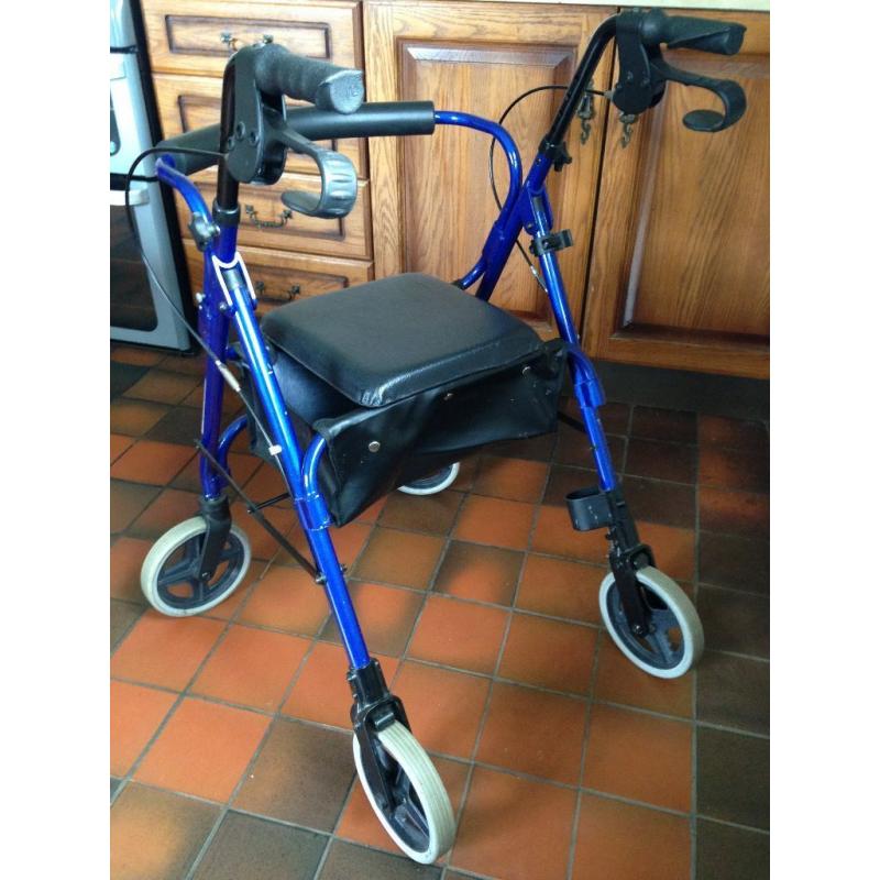 4 wheeled mobility walking aid with seat. Hardly used. Excellent condition