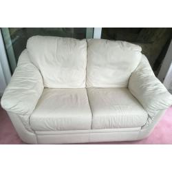 Cream two seater leather sofa