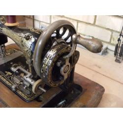 Hand cranked sewing machine.