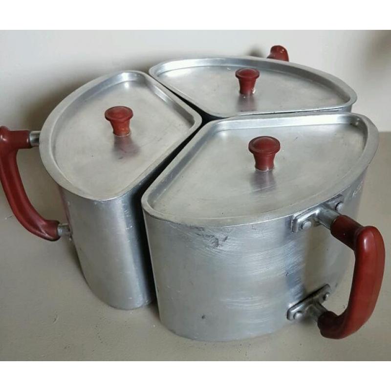 Vintage space saving saucepans with bakelite handles