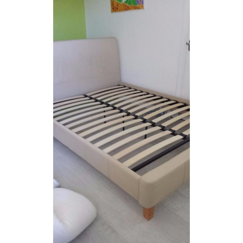 king size bed frame in cream coloured faux leather.