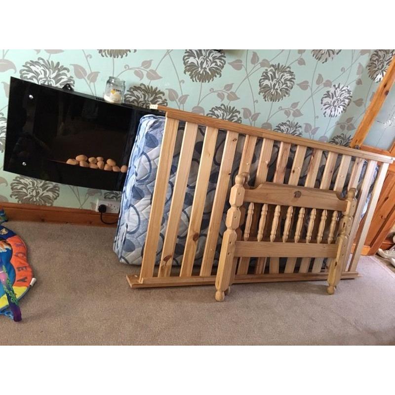 Wooden single bed and mattress