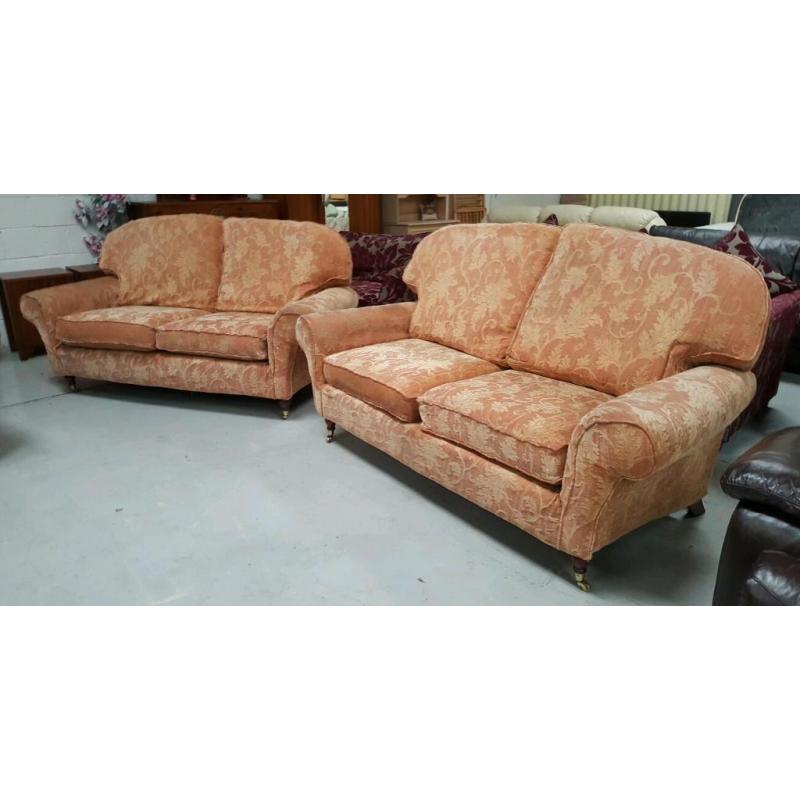 Terracotta 2 x2 seater sofas on brass casters in good condit