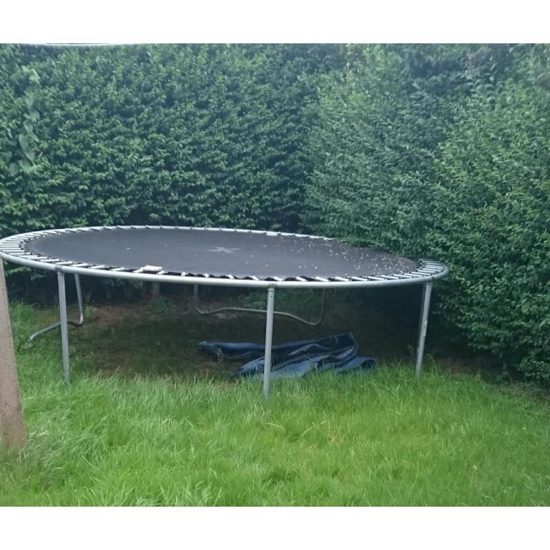 14ft trampoline with new poles and netting