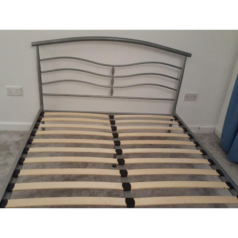 Metal standard double bed frame with slatted base and one matching bedside table, good condition