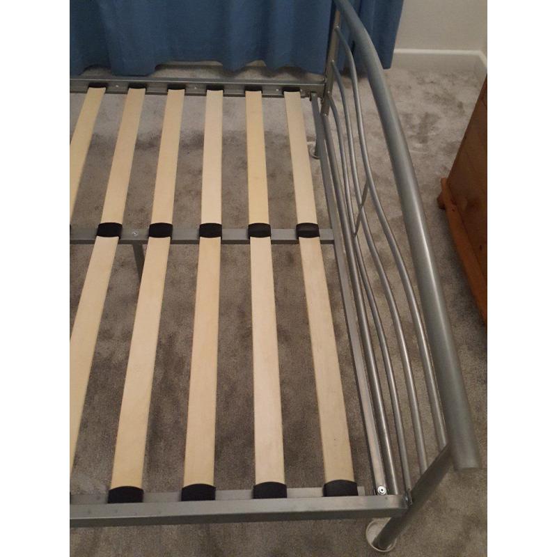 Metal standard double bed frame with slatted base and one matching bedside table, good condition