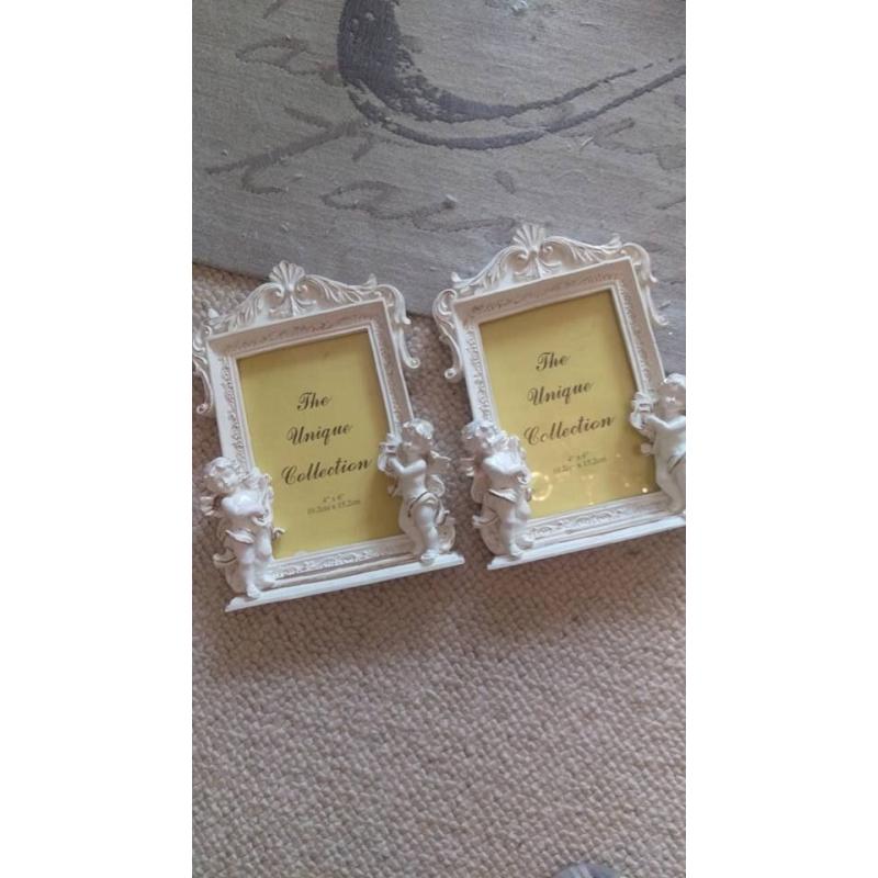 Pair of cherub picture frames