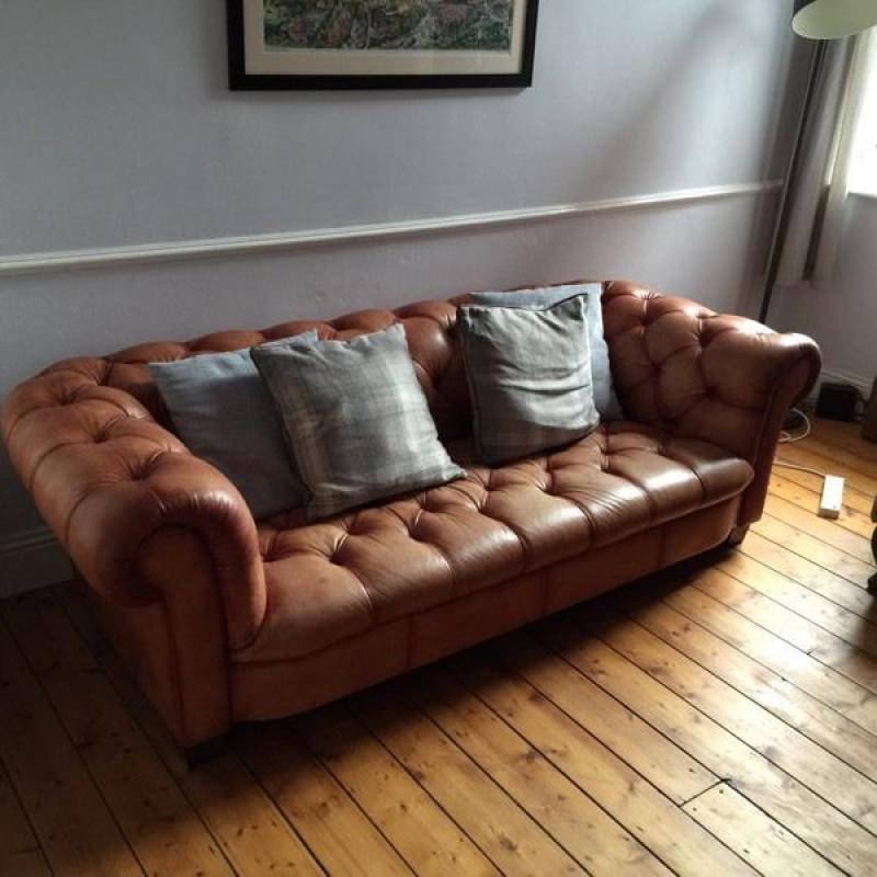 Tan leather Chesterfield style sofa