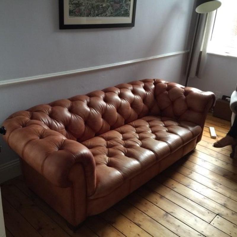 Tan leather Chesterfield style sofa