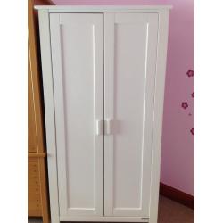 White furniture. Wardrobe and chest of drawers