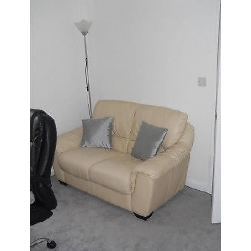 Cream leather 2 seater sofa